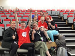 Group of staff and students celebrating at Portland Games