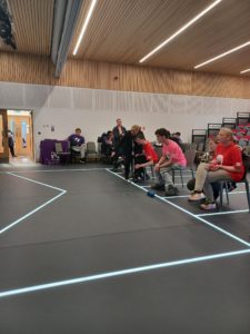 Students playing sports supported by staff